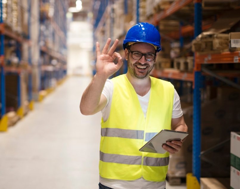 warehouse-worker-standing-large-storage-center-showing-ok-hand-gesture-satisfied-delivering-goods-min.jpeg